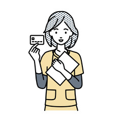 立って書類とカードを手に持つ看護師の女性