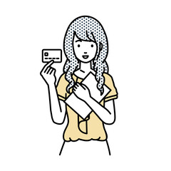 立って書類とカードを手に持つオフィスカジュアルの女性