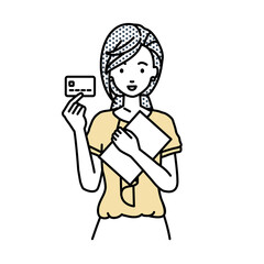 立って書類とカードを手に持つオフィスカジュアルの女性