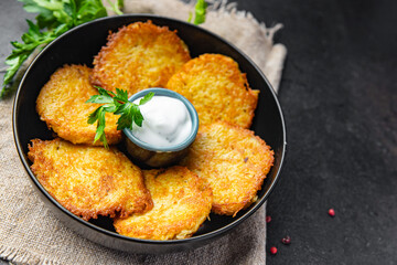 potato pancakes vegetable hash brown draniki fritters second course fresh vegetarian food meal snack on the table copy space food background 