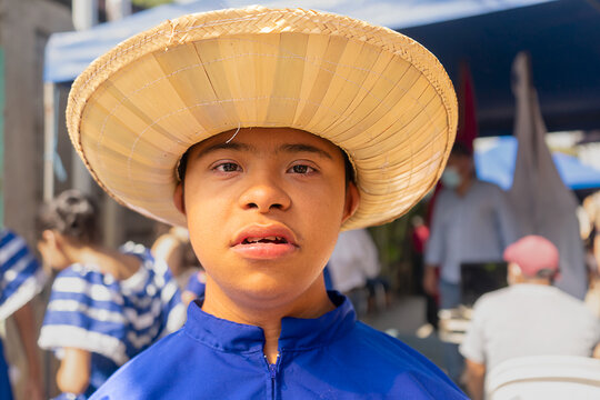 Latino teenager with down syndrome wearing the traditional folkloric costume of Nicaragua