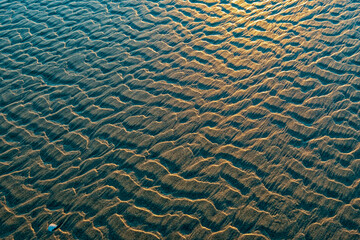 Patterns in the sand on the beach at sunset near Bayshore, Oregon, USA