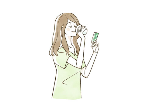薬を飲んでいる女性