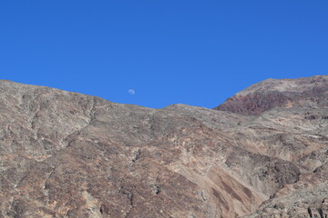 Moon over mountains in Death Valley