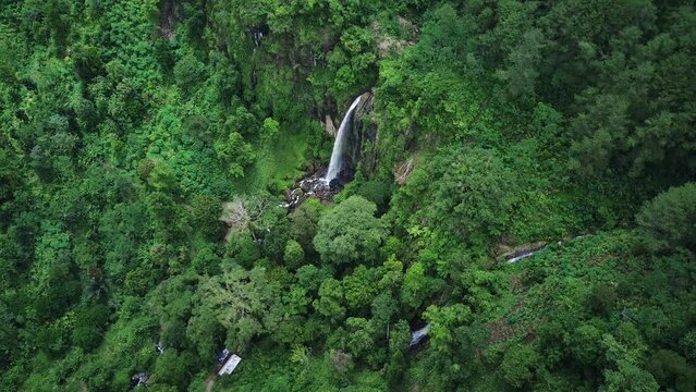 A piece of heaven in Indonesia. Stunning aerial view of hidden gem waterfall in deep forest