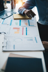 Administration or Accountant discussing with partner are meeting to audit finance planning sales to...