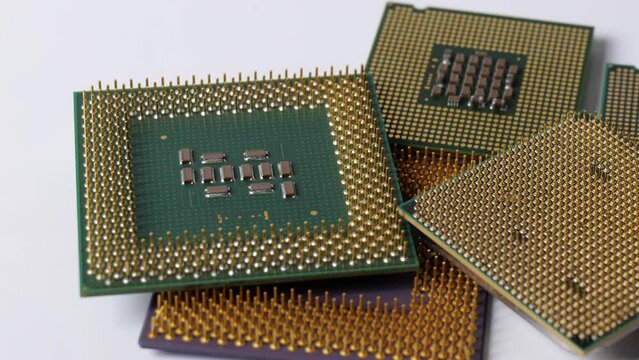 shoot video pan Used old cpu clusters are laid out against a white background in the past they used to be very powerful in the old days but nowadays they are just collectibles 
