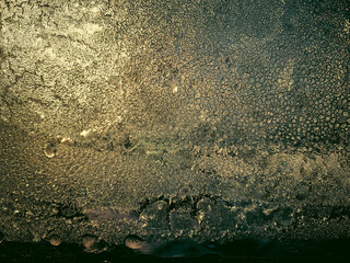 Frozen windows, winter pattern, melting ice kamli. High quality photo