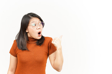 Showing and Pointing Product With Thumb Of Beautiful Asian Woman Isolated On White Background