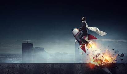 Determined businessman on his way to success leaving fire trails