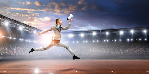 Fototapeta na wymiar Portrait of energetic businessman jumping in open air