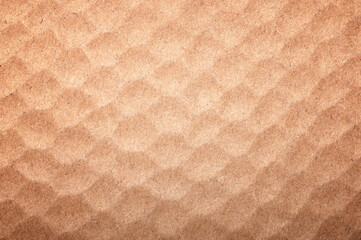 Textured background of brown recycled paper.