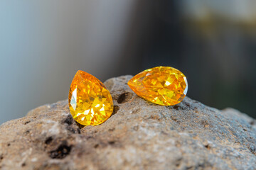 Natural Sapphire gemstone, Jewel or gems on black shine color, natural yellow gemstones on stone