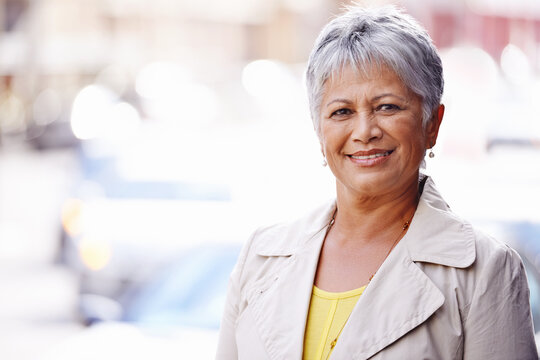 Out and about in the city. Portrait of a mature woman spending a day in the city.