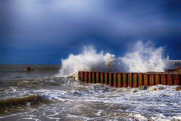 Sea wave stone crash at breakwater
