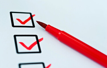 Checklist marked by a red pen