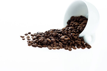 Coffee beans in cup isolated on white background