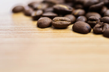 Coffee beans on wooden table