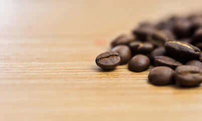 Coffee beans on wooden table