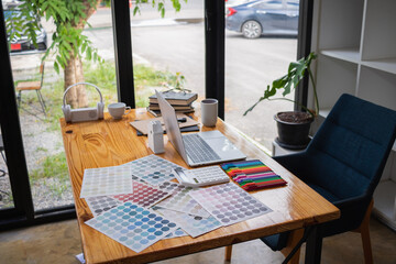 designer or web designer is designing mobile applications and websites with ux ui system and choosing color schemes to match website page. Website development concept UI UX front end designer.