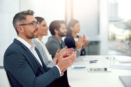 Celebrating Exceptional Work. Cropped Shot Of A Group Of Businesspeople Clapping Their Hands Together In A Modern Office.