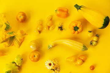 Yellow vegetables on the yellow background