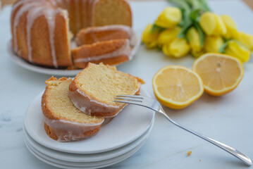 Traditional vanilla pound cake with lemon on a table