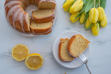 Traditional vanilla pound cake with lemon on a table