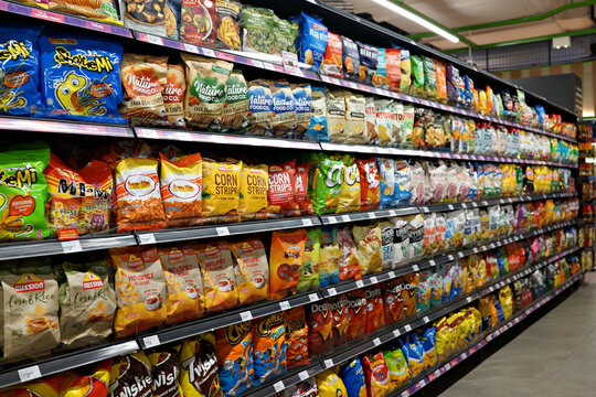 SELANGOR, MALAYSIA - 27 FEB 2022. Various brands of flavoured chips and snacks on store shelf in Village Grocer store. Village Grocer is the coolest fresh premium supermarket in Malaysia.