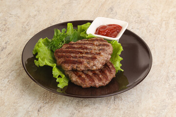 Grilled beef burger cutlet with sauce