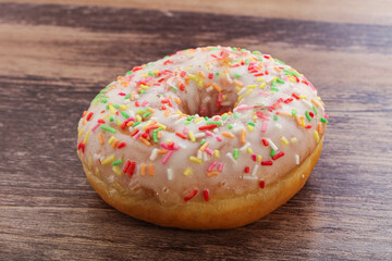 Sweet glazed vanilla donut with icing