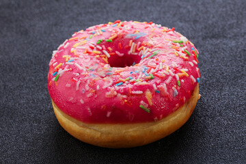 Sweet glazed struwberry donut with icing