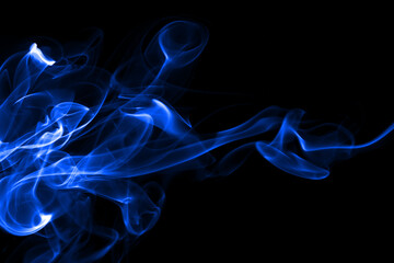 Blue smoke abstract on black background for design. darkness concept