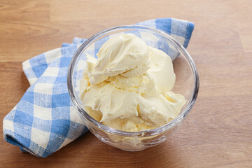 Italian soft mascarpone cheese in the bowl