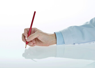 Male doctor hand holding a pencil on white background