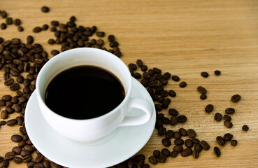 Coffee and beans on wooden table