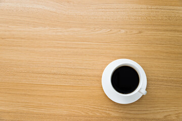 Cup of coffee on wooden table