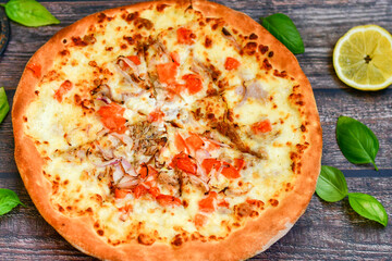   Home made Tuna fish   italian style pizza.   Parmesan cheese, mozzarella  , mushrooms,olives   cherry tomatoes and ,fresh basil