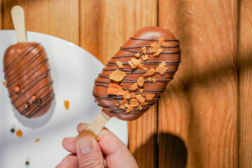 Homemade cookies with raisins, chocolate, nuts and milk on a wooden table and a art background . Breakfast. Close up.