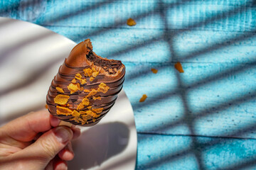 Homemade cookies with raisins, chocolate, nuts and milk on a wooden table and a art background . Breakfast. Close up.