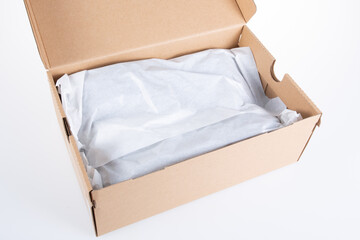 Open empty shoe cardboard box with paper protect