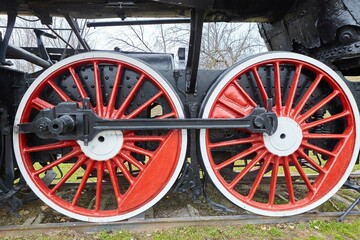 Wheels of an old railway train of the early 19th century in an open-air museum. Historical objects.