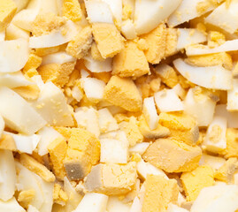 Sliced boiled eggs as a background.