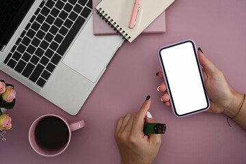 Woman holding smart phone with blank screen for your text message or information content.