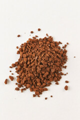instant coffee granules on a white background