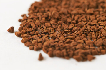 instant coffee granules on a white background