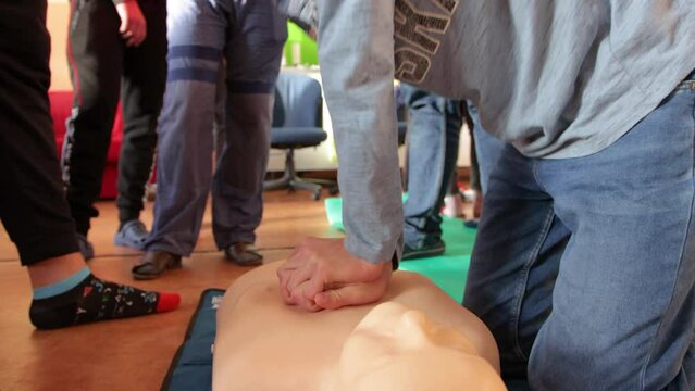 CPR training with CPR dummy. First aid resuscitation concept.