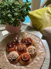 Cinnamon rolls with almond on the table. vertical top view