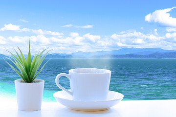A cup of coffee on a sea view terrace.
