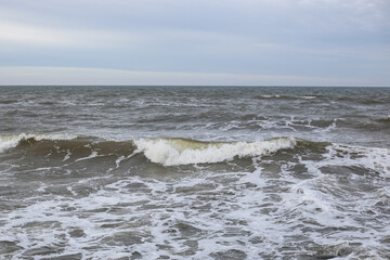 Baltic sea seascape view of shoreline and small waves.